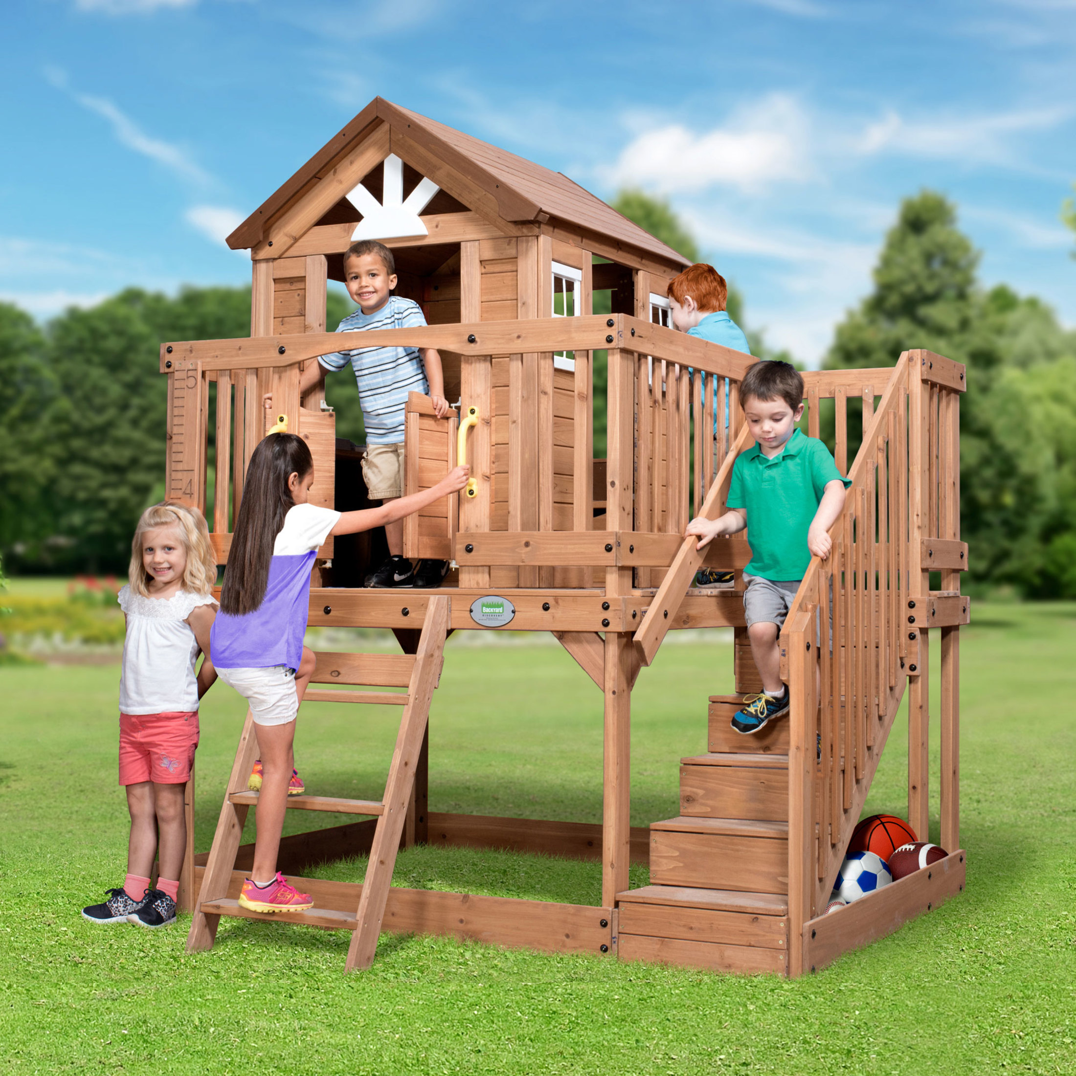 Backyard Discovery Scenic Heights elevated cedar playhouse with children playing