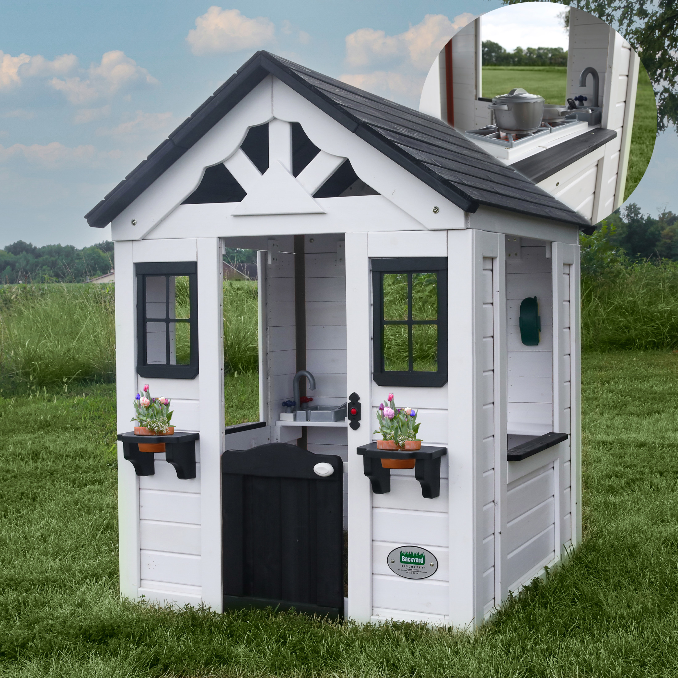 Backyard Discovery white Sweetwater playhouse with black roof and play kitchen